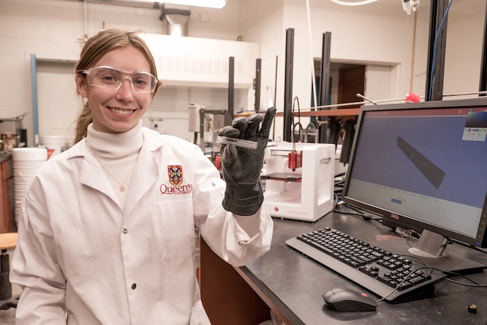 girl in lab coat holding sample