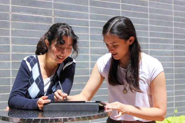 two female students working outside
